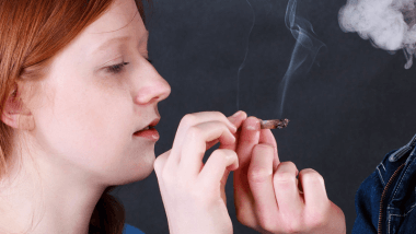 Girl holding a joint