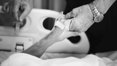 Elderly person in hospital bed