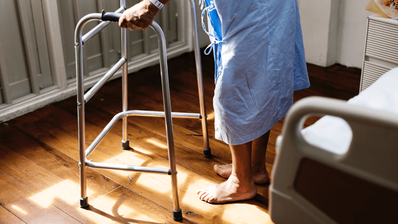 Elderly using zimmer frame