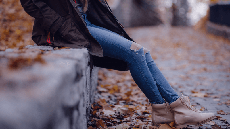 Girl sitting in street