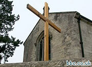 Angry atheist throws cross into village pond