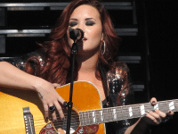 Demi Lovato’s anti-Christian album posters removed by ASA